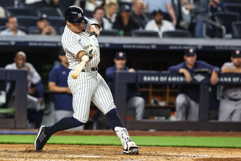 May 7, 2024; Bronx, New York, USA;  New York Yankees shortstop Anthony Volpe (11) hits a two run home run in the fourth inning against the Houston Astros at Yankee Stadium. Mandatory Credit: Wendell Cruz-USA TODAY Sports