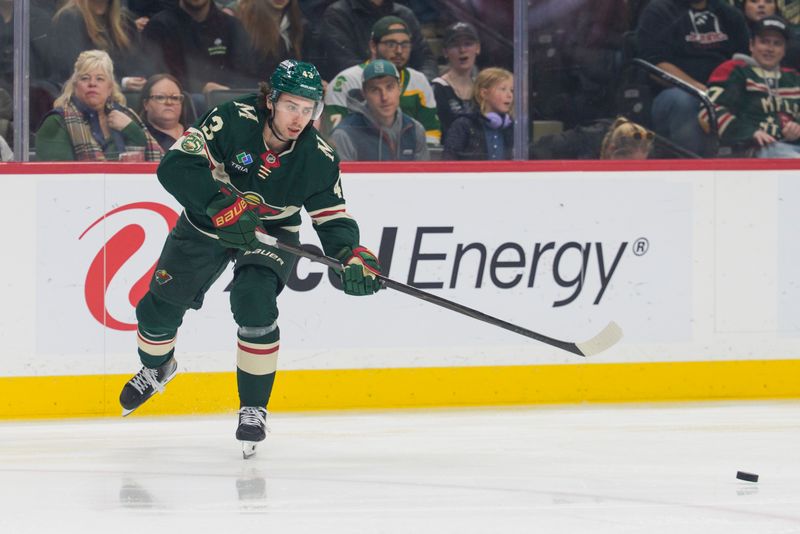 Feb 2, 2026; Saint Paul, Minnesota, USA; Minnesota Wild defenseman Quinn Hughes (43) passes the puck in the defensive zone against the Montreal Canadiens in the first period at Grand Casino Arena. Mandatory Credit: Matt Blewett-Imagn Images