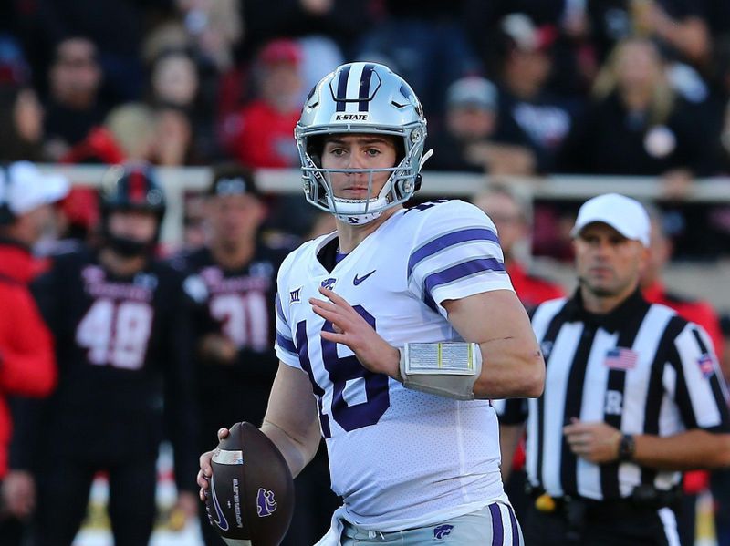 Oct 14, 2023; Lubbock, Texas, USA;  Kansas State Wildcats quarterback Will Howard (18) drops back to pass against the Texas Tech Red Raiders in the first half at Jones AT&T Stadium and Cody Campbell Field. Mandatory Credit: Michael C. Johnson-USA TODAY Sports