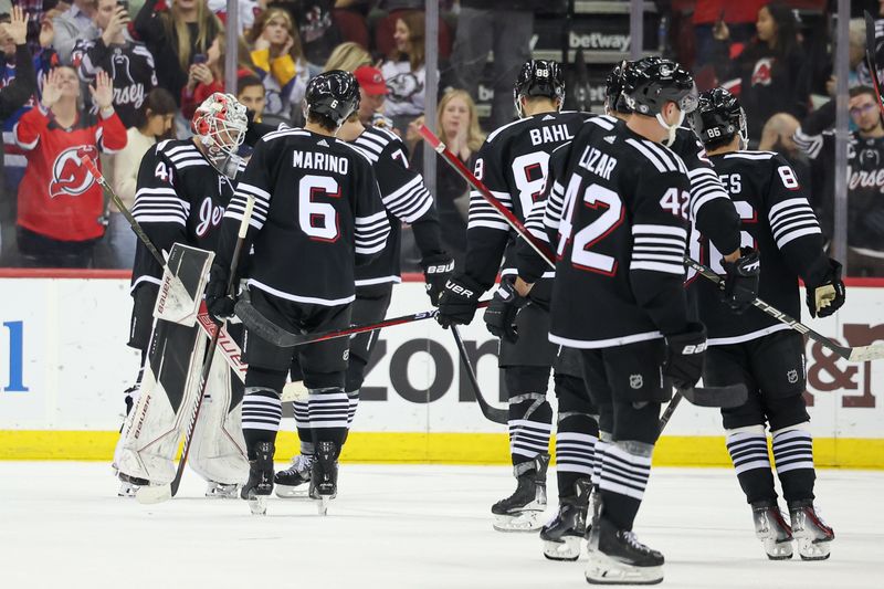 Oct 27, 2023; Newark, New Jersey, USA; New Jersey Devils goaltender Vitek Vanecek (41) celebrates with teammates after defeating the Buffalo Sabres at Prudential Center. Mandatory Credit: Vincent Carchietta-USA TODAY Sports