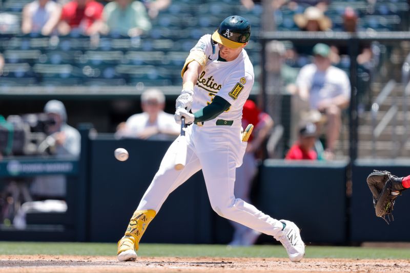 May 22, 2025; West Sacramento, California, USA; Athletics center fielder JJ Bleday (33) hits a single during the second inning against the Los Angeles Angels at Sutter Health Park. Mandatory Credit: Sergio Estrada-Imagn Images