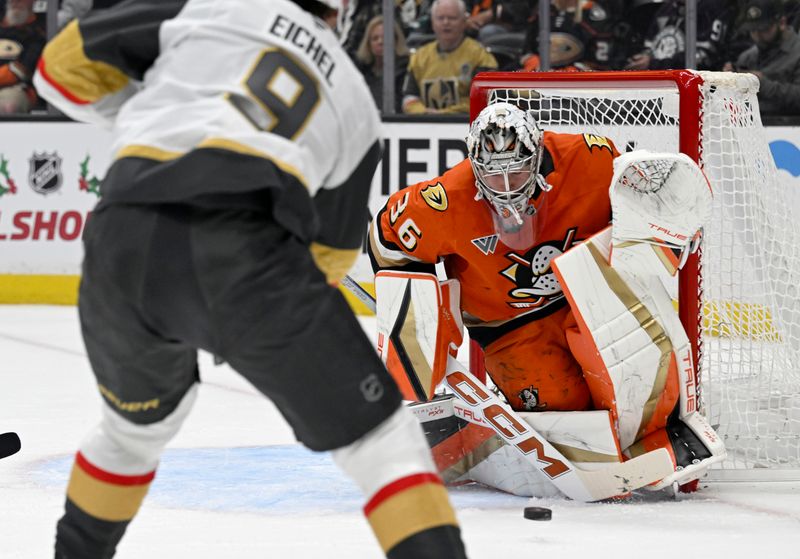 Dec 4, 2024; Anaheim, California, USA;  Anaheim Ducks goaltender John Gibson (36) blocks a shot by Vegas Golden Knights center Jack Eichel (9) during the first period at Honda Center. Mandatory Credit: Alex Gallardo-Imagn Images