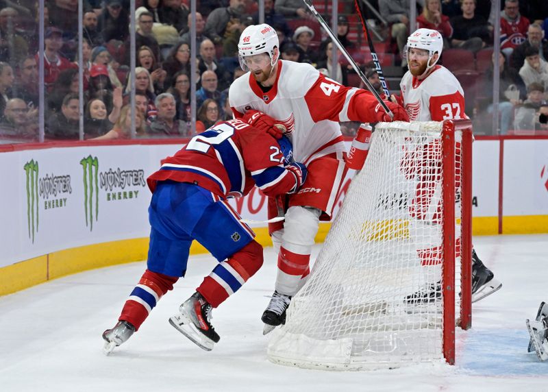 Apr 16, 2024; Montreal, Quebec, CAN; Montreal Canadiens forward Cole Caufield (22) and Detroit Red Wings defenseman Jeff Petry (46) tussle during the second period at the Bell Centre. Mandatory Credit: Eric Bolte-USA TODAY Sports