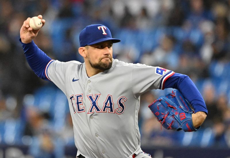 Sep 14, 2023; Toronto, Ontario, CAN;   Texas Rangers starting pitcher Nathan Eovaldi (17) delivers a pitch against the Toronto Blue Jays in the first inning at Rogers Centre. Mandatory Credit: Dan Hamilton-USA TODAY Sports