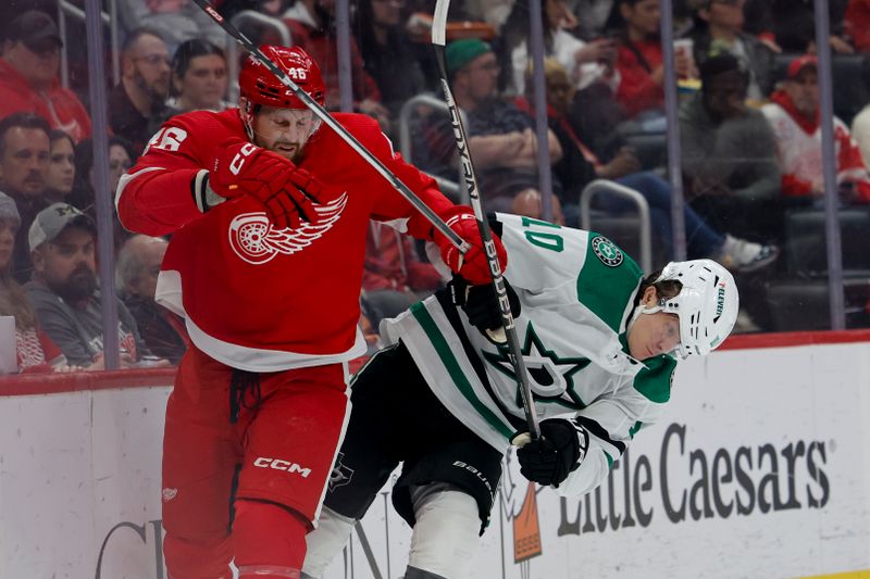 Jan 23, 2024; Detroit, Michigan, USA;  Detroit Red Wings defenseman Jeff Petry (46) and Dallas Stars center Ty Dellandrea (10) battle for the puck in the first period at Little Caesars Arena. Mandatory Credit: Rick Osentoski-USA TODAY Sports