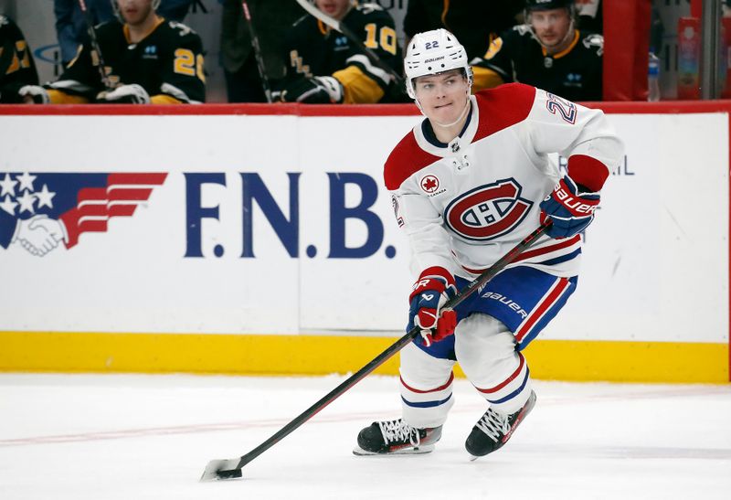 Feb 22, 2024; Pittsburgh, Pennsylvania, USA; Montreal Canadiens right wing Cole Caufield (22) handles the puck against the Pittsburgh Penguins during the third period at PPG Paints Arena. The Penguins won 4-1.Mandatory Credit: Charles LeClaire-USA TODAY Sports