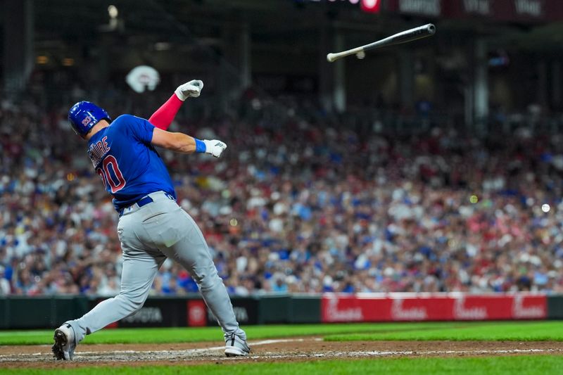 Sep 20, 2025; Cincinnati, Ohio, USA; Chicago Cubs catcher Reese McGuire (20) loses his bat as he bats against the Cincinnati Reds in the eighth inning at Great American Ball Park. Mandatory Credit: Aaron Doster-Imagn Images