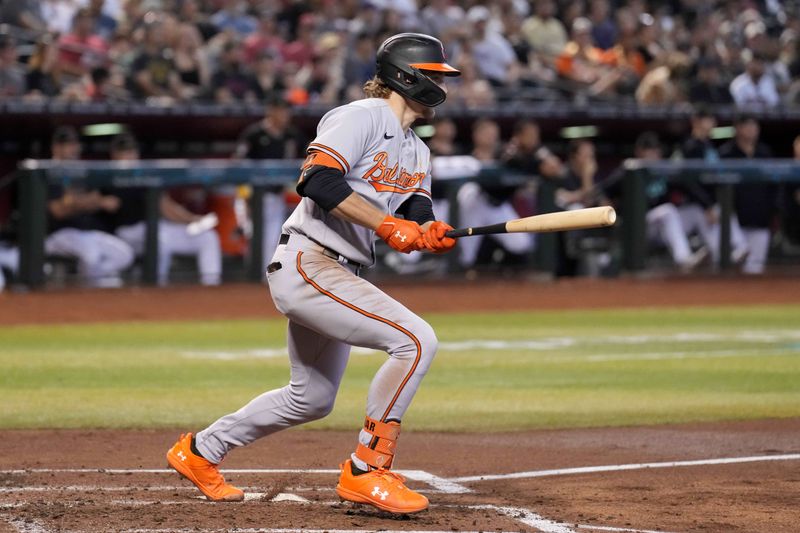 Sep 3, 2023; Phoenix, Arizona, USA; Baltimore Orioles shortstop Gunnar Henderson (2) hits an RBI single against the Arizona Diamondbacks during the first inning at Chase Field. Mandatory Credit: Joe Camporeale-USA TODAY Sports