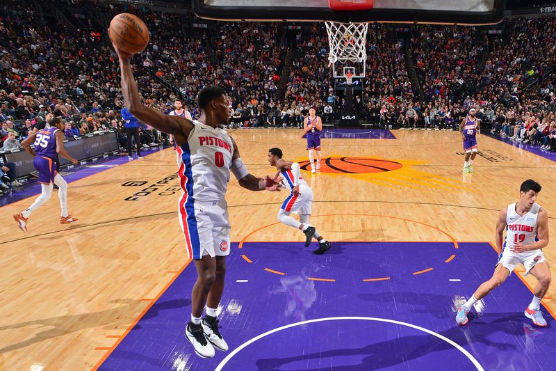 PHOENIX, AZ - FEBRUARY 14: Jalen Duren #0 of the Detroit Pistons rebounds during the game against the Phoenix Suns on February 14, 2024 at Footprint Center in Phoenix, Arizona. NOTE TO USER: User expressly acknowledges and agrees that, by downloading and or using this photograph, user is consenting to the terms and conditions of the Getty Images License Agreement. Mandatory Copyright Notice: Copyright 2024 NBAE (Photo by Kate Frese/NBAE via Getty Images)