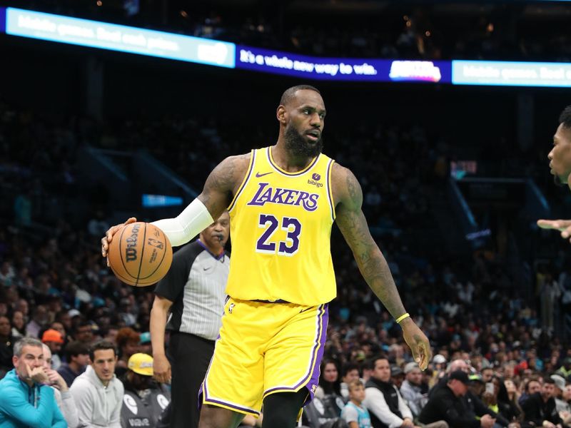 CHARLOTTE, NC - FEBRUARY 5: LeBron James #23 of the Los Angeles Lakers handles the ball during the game against the Charlotte Hornets on February 5, 2024 at Spectrum Center in Charlotte, North Carolina. NOTE TO USER: User expressly acknowledges and agrees that, by downloading and or using this photograph, User is consenting to the terms and conditions of the Getty Images License Agreement.  Mandatory Copyright Notice:  Copyright 2024 NBAE (Photo by Brock Williams-Smith/NBAE via Getty Images)