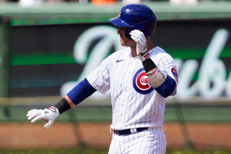 Sep 4, 2023; Chicago, Illinois, USA; Chicago Cubs catcher Yan Gomes (15) gestures after hitting a double against the San Francisco Giants during the fifth inning at Wrigley Field. Mandatory Credit: David Banks-USA TODAY Sports