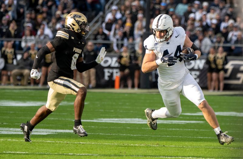 Nov 16, 2024; West Lafayette, Indiana, USA; Penn State Nittany Lions tight end Tyler Warren (44) is defended by Purdue Boilermakers defensive back Smiley Bradford (6) during the first quarter at Ross-Ade Stadium. Mandatory Credit: Marc Lebryk-Imagn Images