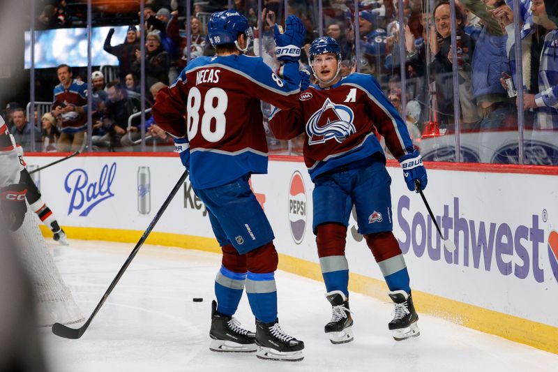 Jan 8, 2026; Denver, Colorado, USA; Colorado Avalanche defenseman Cale Makar (8) celebrates his goal with center Martin Necas (88) in the second period against the Ottawa Senators at Ball Arena. Mandatory Credit: Isaiah J. Downing-Imagn Images