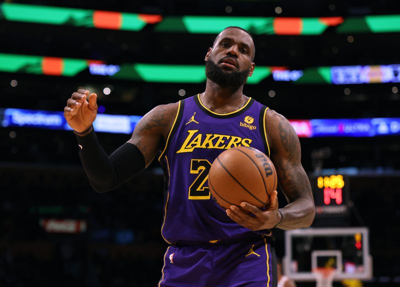 LOS ANGELES, CALIFORNIA - JANUARY 11: LeBron James #23 of the Los Angeles Lakers reacts to a Lakers foul during the first half against the Phoenix Suns at Crypto.com Arena on January 11, 2024 in Los Angeles, California. User is consenting to the terms and conditions of the Getty Images License Agreement.  (Photo by Harry How/Getty Images)