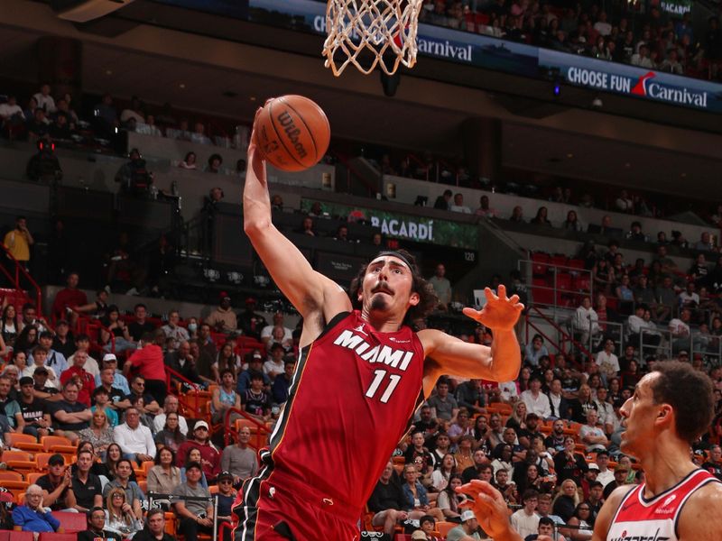 MIAMI, FL - MARCH 10: Jaime Jaquez Jr. #11 of the Miami Heat dunks the ball during the game against the Washington Wizards on March 10, 2024 at Kaseya Center in Miami, Florida. NOTE TO USER: User expressly acknowledges and agrees that, by downloading and or using this Photograph, user is consenting to the terms and conditions of the Getty Images License Agreement. Mandatory Copyright Notice: Copyright 2024 NBAE (Photo by Issac Baldizon/NBAE via Getty Images)