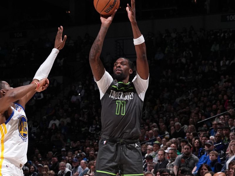 MINNEAPOLIS, MN -  MARCH 24: Naz Reid #11 of the Minnesota Timberwolves shoots the ball during the game against the Golden State Warriors on March 24, 2024 at Target Center in Minneapolis, Minnesota. NOTE TO USER: User expressly acknowledges and agrees that, by downloading and or using this Photograph, user is consenting to the terms and conditions of the Getty Images License Agreement. Mandatory Copyright Notice: Copyright 2024 NBAE (Photo by Jordan Johnson/NBAE via Getty Images)