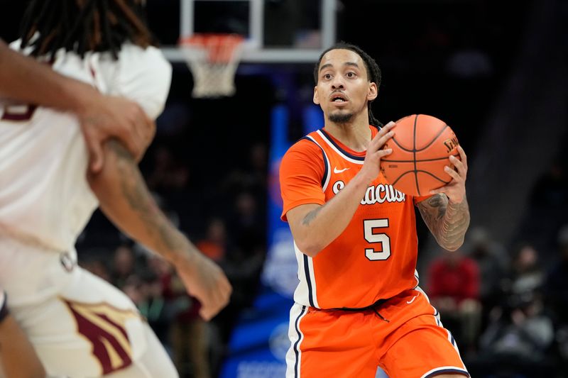 Mar 11, 2025; Charlotte, NC, USA; Syracuse Orange guard Jaquan Carlos (5) with the ball in the second half at Spectrum Center. Mandatory Credit: Bob Donnan-Imagn Images