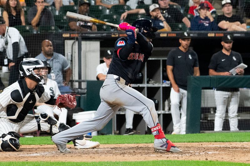 Sep 10, 2024; Chicago, Illinois, USA;  Cleveland Guardians second baseman Andres Gimenez (0) hits a RBI single against the Chicago White Sox during the ninth inning at Guaranteed Rate Field. Mandatory Credit: Matt Marton-Imagn Images