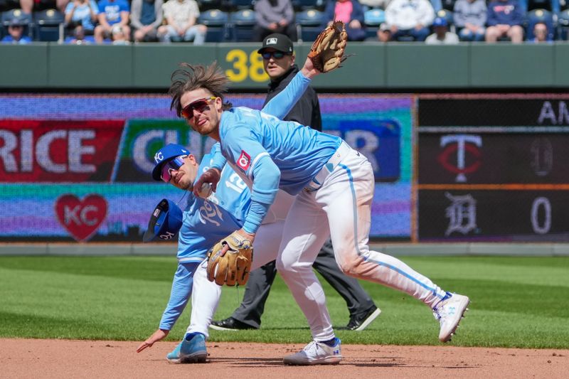 Apr 11, 2024; Kansas City, Missouri, USA; Kansas City Royals second base Nick Loftin (12) dives over shortstop Bobby Witt Jr. (7) going for a ground ball against the Houston Astros in the fourth inning at Kauffman Stadium. Mandatory Credit: Denny Medley-USA TODAY Sports