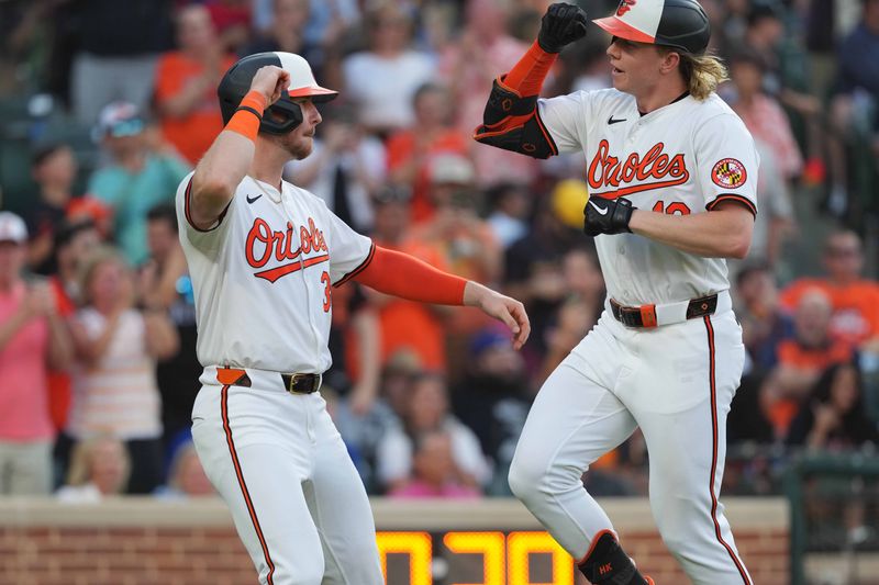 Jun 27, 2024; Baltimore, Maryland, USA; Baltimore Orioles outfielder Heston Kjerstad (13) greeted by designated hitter Ryan O’Hearn (32) following his two-run home run in the third inning against the Texas Rangers at Oriole Park at Camden Yards. Mandatory Credit: Mitch Stringer-USA TODAY Sports