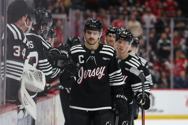 Nov 24, 2025; Newark, New Jersey, USA; New Jersey Devils center Nico Hischier (13) celebrates his goal against the Detroit Red Wings during the first period at Prudential Center. Mandatory Credit: Ed Mulholland-Imagn Images