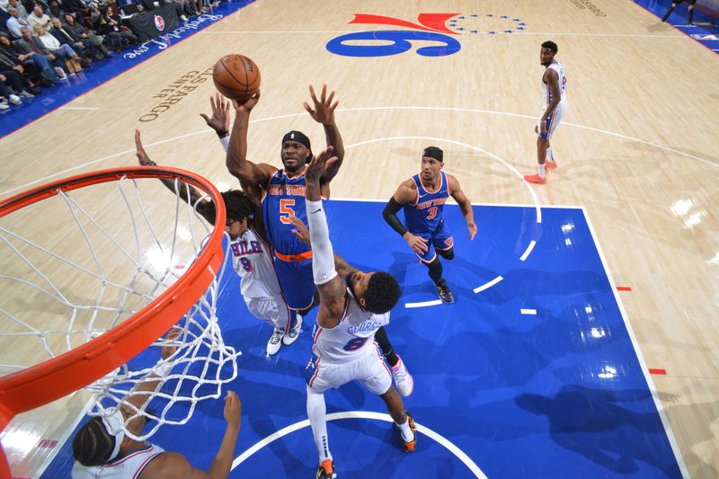 PHILADELPHIA, PA - JANUARY 15:  Precious Achiuwa #5 of the New York Knicks drives to the basket during the game against the Philadelphia 76ers on January 15, 2025 at the Wells Fargo Center in Philadelphia, Pennsylvania NOTE TO USER: User expressly acknowledges and agrees that, by downloading and/or using this Photograph, user is consenting to the terms and conditions of the Getty Images License Agreement. Mandatory Copyright Notice: Copyright 2025 NBAE (Photo by Jesse D. Garrabrant/NBAE via Getty Images)