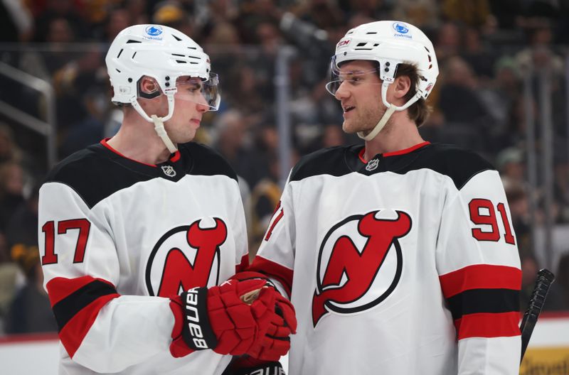 Feb 26, 2026; Pittsburgh, Pennsylvania, USA;  New Jersey Devils defenseman Simon Nemec (17) and center Dawson Mercer (91) talk on the ice against the Pittsburgh Penguins during the first period at PPG Paints Arena. Mandatory Credit: Charles LeClaire-Imagn Images