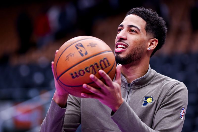 TORONTO, CANADA - DECEMBER 3: Tyrese Haliburton #0 of the Indiana Pacers warms up before the game against the Toronto Raptors during the Emirates NBA Cup game on December 3, 2024 at the Scotiabank Arena in Toronto, Ontario, Canada.  NOTE TO USER: User expressly acknowledges and agrees that, by downloading and or using this Photograph, user is consenting to the terms and conditions of the Getty Images License Agreement.  Mandatory Copyright Notice: Copyright 2024 NBAE (Photo by Vaughn Ridley/NBAE via Getty Images)