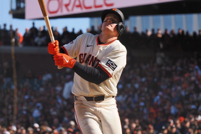 Apr 5, 2024; San Francisco, California, USA; San Francisco Giants third baseman Matt Chapman (26) is hit by pitch during the ninth inning against the San Diego Padres at Oracle Park. Mandatory Credit: Kelley L Cox-USA TODAY Sports