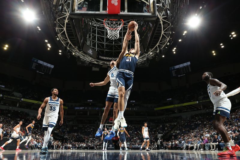 MINNEAPOLIS, MN -  OCTOBER 17: Vlatko Cancar #31 of the Denver Nuggets dunks the ball during the game against the Minnesota Timberwolves during the 2024 NBA Preseason on October 17, 2024 at Target Center in Minneapolis, Minnesota. NOTE TO USER: User expressly acknowledges and agrees that, by downloading and or using this Photograph, user is consenting to the terms and conditions of the Getty Images License Agreement. Mandatory Copyright Notice: Copyright 2024 NBAE (Photo by David Sherman/NBAE via Getty Images)