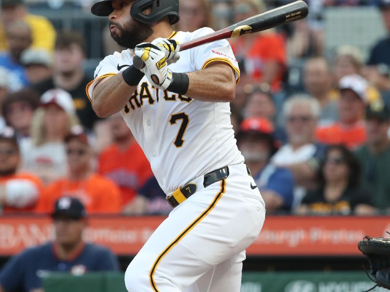 Jun 4, 2025; Pittsburgh, Pennsylvania, USA;  Pittsburgh Pirates shortstop Isiah Kiner-Falefa (7) drives in a run with a sacrifice fly against the Houston Astros during the second inning at PNC Park. Mandatory Credit: Charles LeClaire-Imagn Images