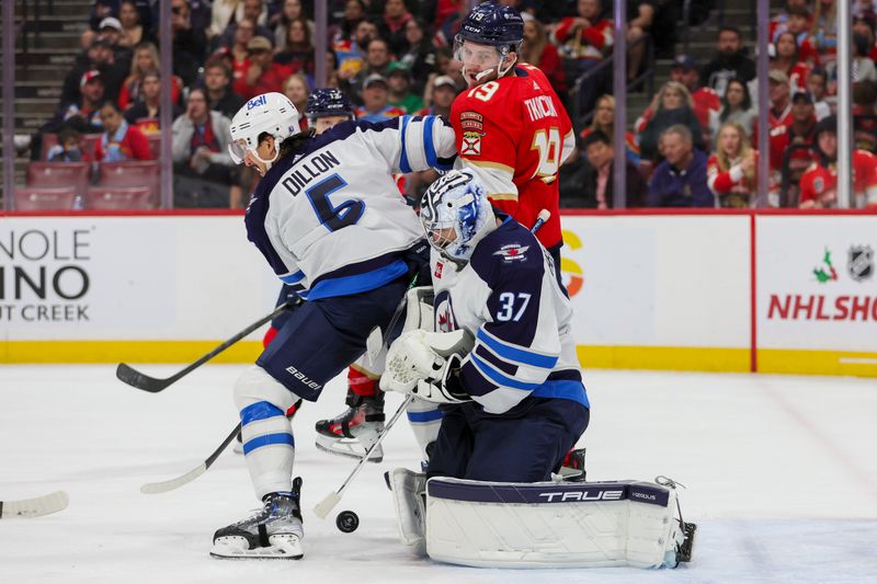 Nov 24, 2023; Sunrise, Florida, USA; Winnipeg Jets goaltender Connor Hellebuyck (37) defends his net against the Florida Panthers during the second period at Amerant Bank Arena. Mandatory Credit: Sam Navarro-USA TODAY Sports