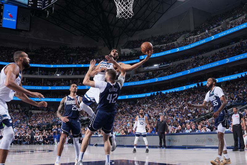 DALLAS, TX - MAY 28:  Karl-Anthony Towns #32 of the Minnesota Timberwolves drives to the basket during the game against the Dallas Mavericks during Game 3 of the Western Conference Finals of the 2024 NBA Playoffs on May 28, 2024 at the American Airlines Center in Dallas, Texas. NOTE TO USER: User expressly acknowledges and agrees that, by downloading and or using this photograph, User is consenting to the terms and conditions of the Getty Images License Agreement. Mandatory Copyright Notice: Copyright 2024 NBAE (Photo by Jesse D. Garrabrant/NBAE via Getty Images)