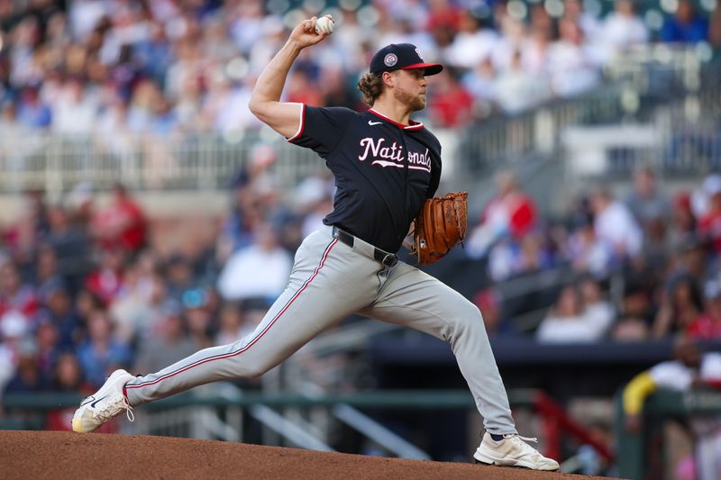 May 12, 2025; Atlanta, Georgia, USA; Washington Nationals starting pitcher Jake Irvin (27) throws against the Atlanta Braves in the first inning at Truist Park. Mandatory Credit: Brett Davis-Imagn Images