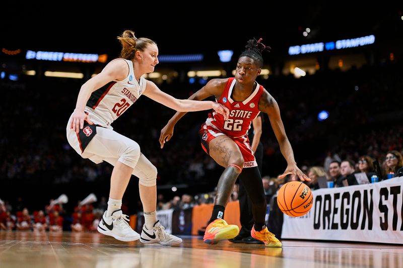 Mar 29, 2024; Portland, OR, USA;  NC State Wolfpack guard Saniya Rivers (22) drives to the basket during the first half against Stanford Cardinal guard Elena Bosgana (20) in the semifinals of the Portland Regional of the 2024 NCAA Tournament at the Moda Center at the Moda Center. Mandatory Credit: Troy Wayrynen-USA TODAY Sports