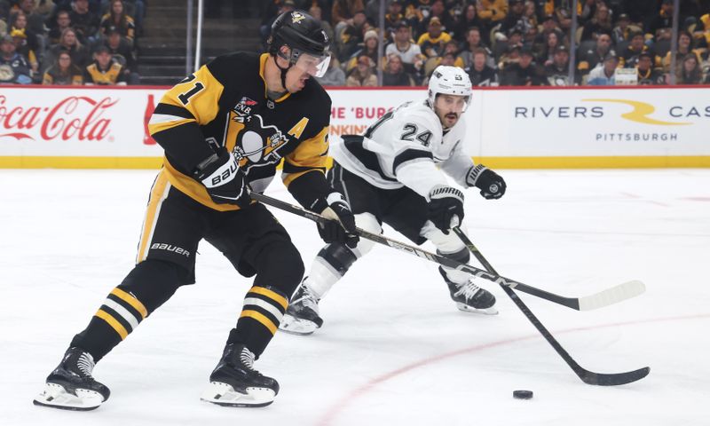 Nov 9, 2025; Pittsburgh, Pennsylvania, USA; Pittsburgh Penguins center Evgeni Malkin (71) moves the puck  against Los Angeles Kings center Phillip Danault (24) during the first period at PPG Paints Arena. Mandatory Credit: Charles LeClaire-Imagn Images