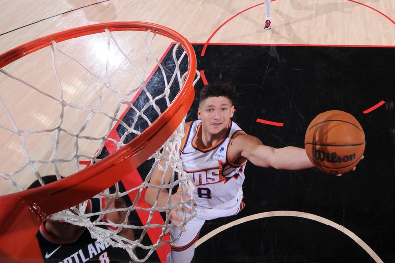 PORTLAND, OR - JANUARY 14: Grayson Allen #8 of the Phoenix Suns drives to the basket during the game against the Portland Trail Blazers on January 14, 2024 at the Moda Center Arena in Portland, Oregon. NOTE TO USER: User expressly acknowledges and agrees that, by downloading and or using this photograph, user is consenting to the terms and conditions of the Getty Images License Agreement. Mandatory Copyright Notice: Copyright 2024 NBAE (Photo by Cameron Browne/NBAE via Getty Images)