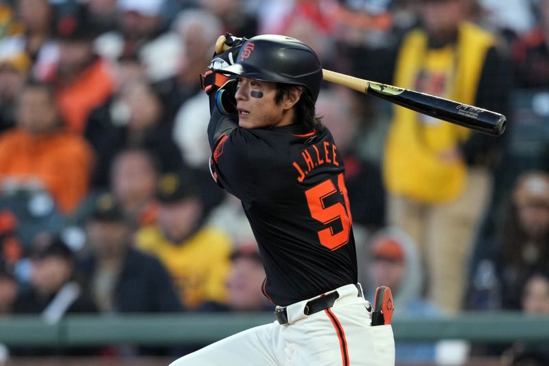 Apr 27, 2024; San Francisco, California, USA; San Francisco Giants center fielder Jung Hoo Lee (51) hits a single against the Pittsburgh Pirates during the sixth inning at Oracle Park. Mandatory Credit: Darren Yamashita-USA TODAY Sports