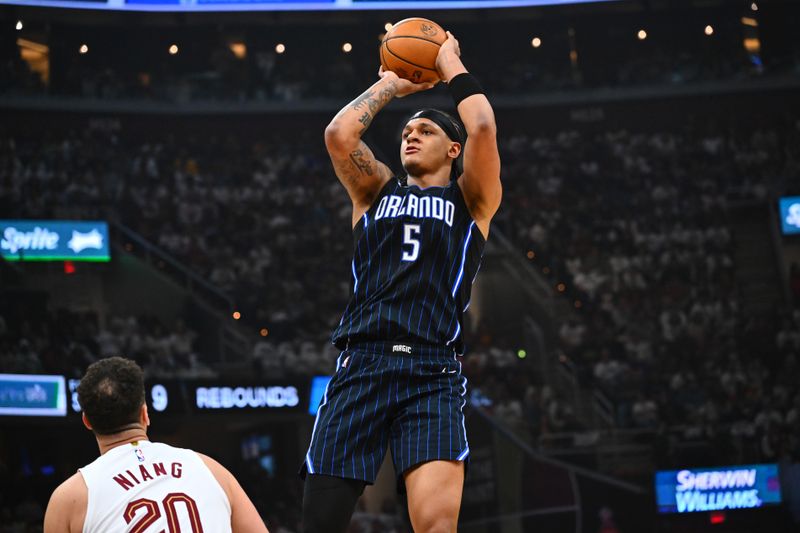 CLEVELAND, OHIO - APRIL 22: Paolo Banchero #5 of the Orlando Magic shoots during the first quarter of game two of the Eastern Conference First Round Playoffs against the Cleveland Cavaliers at Rocket Mortgage Fieldhouse on April 22, 2024 in Cleveland, Ohio. NOTE TO USER: User expressly acknowledges and agrees that, by downloading and or using this photograph, User is consenting to the terms and conditions of the Getty Images License Agreement. (Photo by Jason Miller/Getty Images)