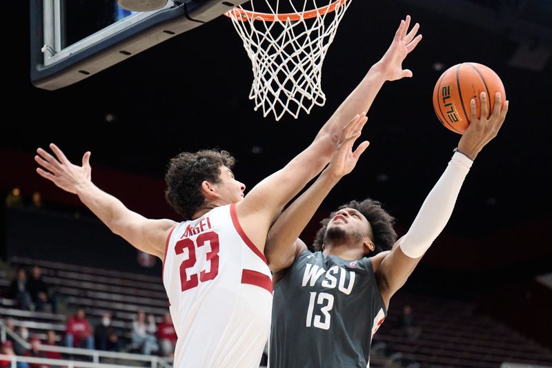 Jan 18, 2024; Stanford, California, USA; Washington State Cougars forward Isaac Jones (13) shoots the ball against Stanford Cardinal forward Brandon Angel (23) during the first half at Maples Pavilion. Mandatory Credit: Robert Edwards-USA TODAY Sports