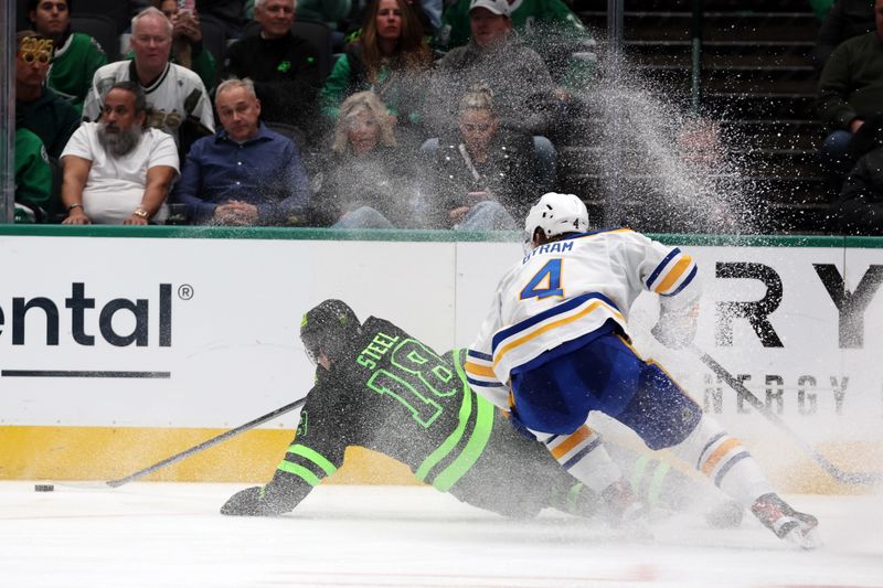 Dec 31, 2024; Dallas, Texas, USA; Dallas Stars center Sam Steel (18) falls down while defended by Buffalo Sabres defenseman Bowen Byram (4) during the third period at American Airlines Center. Mandatory Credit: Tim Heitman-Imagn Images