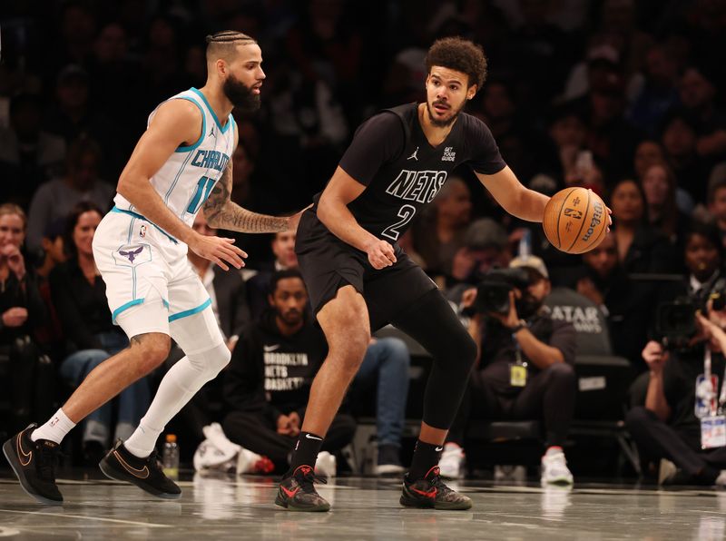 NEW YORK, NEW YORK - NOVEMBER 19:  Cameron Johnson #2 of the Brooklyn Nets in action against Cody Martin #11 of the Charlotte Hornets  during their game at Barclays Center on November 19, 2024 in New York City.   User expressly acknowledges and agrees that, by downloading and or using this photograph, User is consenting to the terms and conditions of the Getty Images License Agreement.  (Photo by Al Bello/Getty Images)