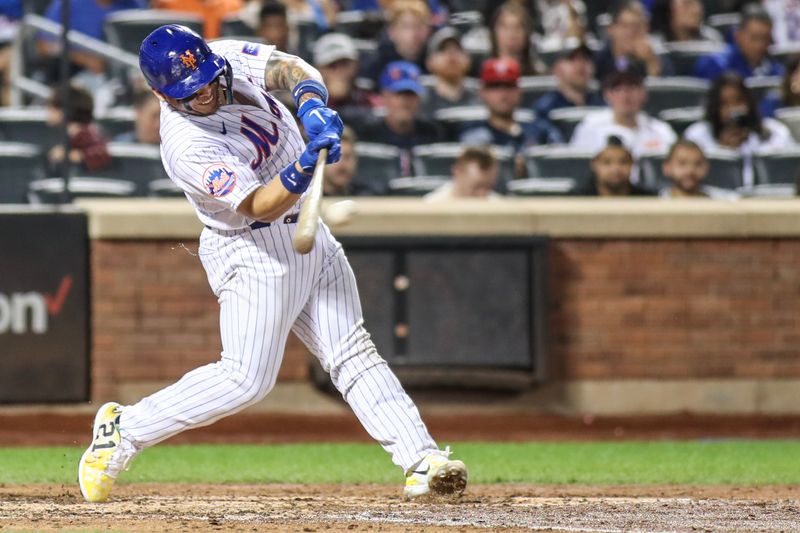 Sep 16, 2023; New York City, New York, USA; New York Mets catcher Francisco Alvarez (4) hits an RBI double in the fourth inning against the Cincinnati Reds at Citi Field. Mandatory Credit: Wendell Cruz-USA TODAY Sports