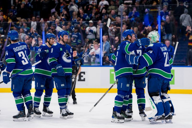 Mar 9, 2024; Vancouver, British Columbia, CAN; Vancouver Canucks forward Pius Suter (24) and forward J.T. Miller (9) and forward Brock Boeser (6) and goalie Casey DeSmith (29) celebrate their victory against the Winnipeg Jets at Rogers Arena. Canucks won 5-0. Mandatory Credit: Bob Frid-USA TODAY Sports