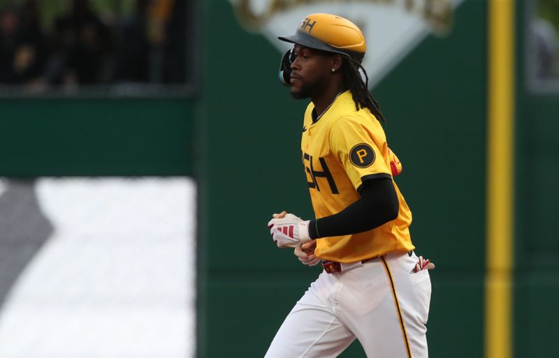May 23, 2025; Pittsburgh, Pennsylvania, USA;  Pittsburgh Pirates center fielder Oneil Cruz (15) circles the bases on a solo home run against the Milwaukee Brewers during the third inning at PNC Park. Mandatory Credit: Charles LeClaire-Imagn Images