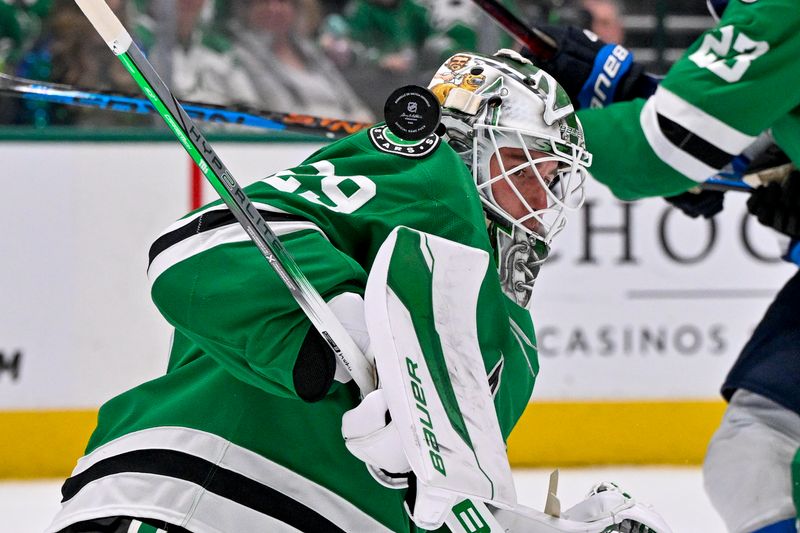 Dec 1, 2024; Dallas, Texas, USA; Dallas Stars goaltender Jake Oettinger (29) makes a save on a Winnipeg Jets shot during the first period at the American Airlines Center. Mandatory Credit: Jerome Miron-Imagn Images