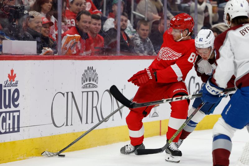 Feb 22, 2024; Detroit, Michigan, USA;  Detroit Red Wings right wing Patrick Kane (88) skates with the puck defended by Colorado Avalanche left wing Artturi Lehkonen (62) in the second period at Little Caesars Arena. Mandatory Credit: Rick Osentoski-USA TODAY Sports