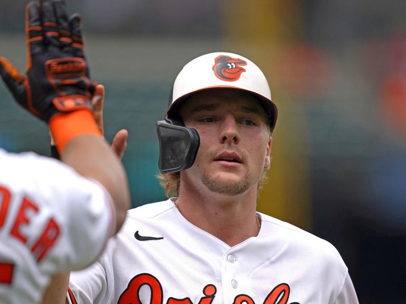 Jul 16, 2023; Baltimore, Maryland, USA; Baltimore Orioles  shortstop Gunnar Henderson (2) greeted by outfielder Anthony Santander (25) after scoring a run in the first inning against the Miami Marlins at Oriole Park at Camden Yards. Mandatory Credit: Mitch Stringer-USA TODAY Sports