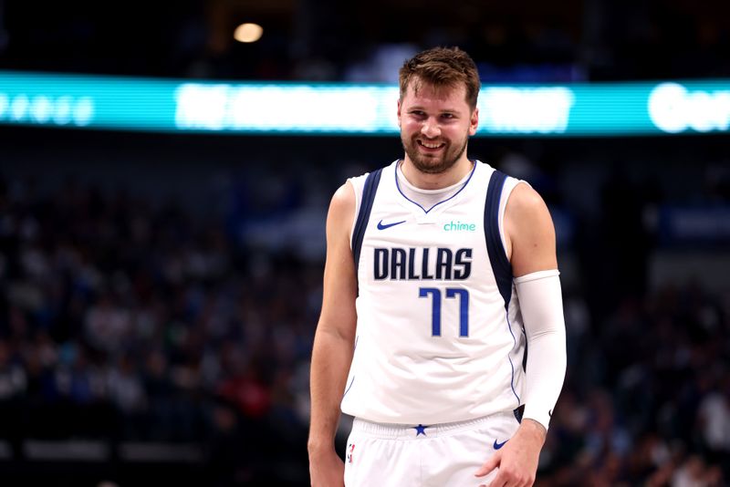 DALLAS, TEXAS - MARCH 13: Luka Doncic #77 of the Dallas Mavericks smiles while on the free throw line in the first half against the Golden State Warriors at American Airlines Center on March 13, 2024 in Dallas, Texas. NOTE TO USER: User expressly acknowledges and agrees that, by downloading and or using this photograph, User is consenting to the terms and conditions of the Getty Images License Agreement. (Photo by Tim Heitman/Getty Images)