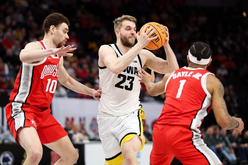 Mar 14, 2024; Minneapolis, MN, USA; Iowa Hawkeyes forward Ben Krikke (23) passes as Ohio State Buckeyes forward Jamison Battle (10) and guard Roddy Gayle Jr. (1) defend during the first half at Target Center. Mandatory Credit: Matt Krohn-USA TODAY Sports